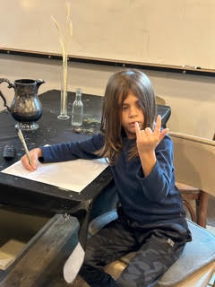 Art supplies and student work at the Atelier